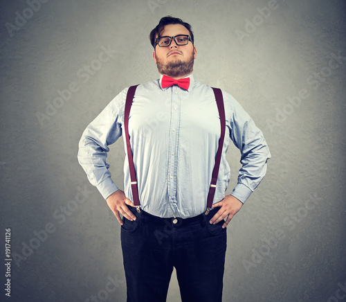 Obraz na plátně Overconfident chubby man in bowtie