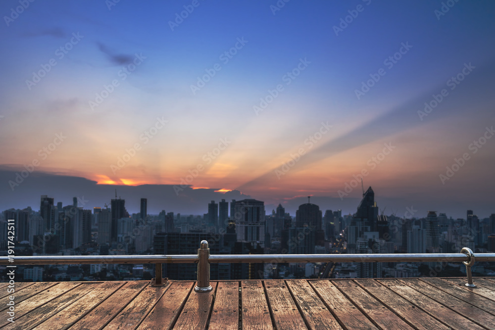 sunset cityscape view on wood perspective balcony