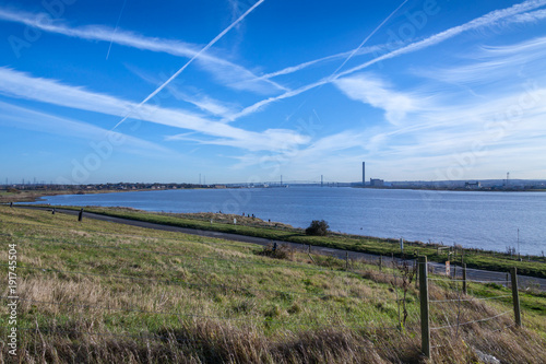 air pollution by airplanes on a sunny day by river Thames