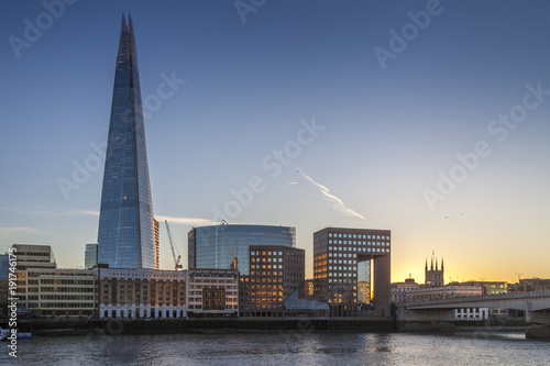 The Shard and London Bridge by river Thames during sunset