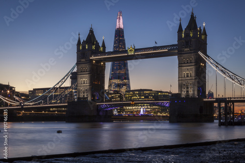 Tower Bridge and the Shard in London at night or sunset