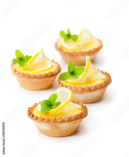 egg  custard tarts with lemon isolated on white