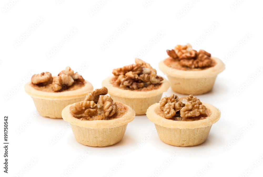 mini ginger and walnut tarts isolated on white mini ginger and walnut tarts isolated on white