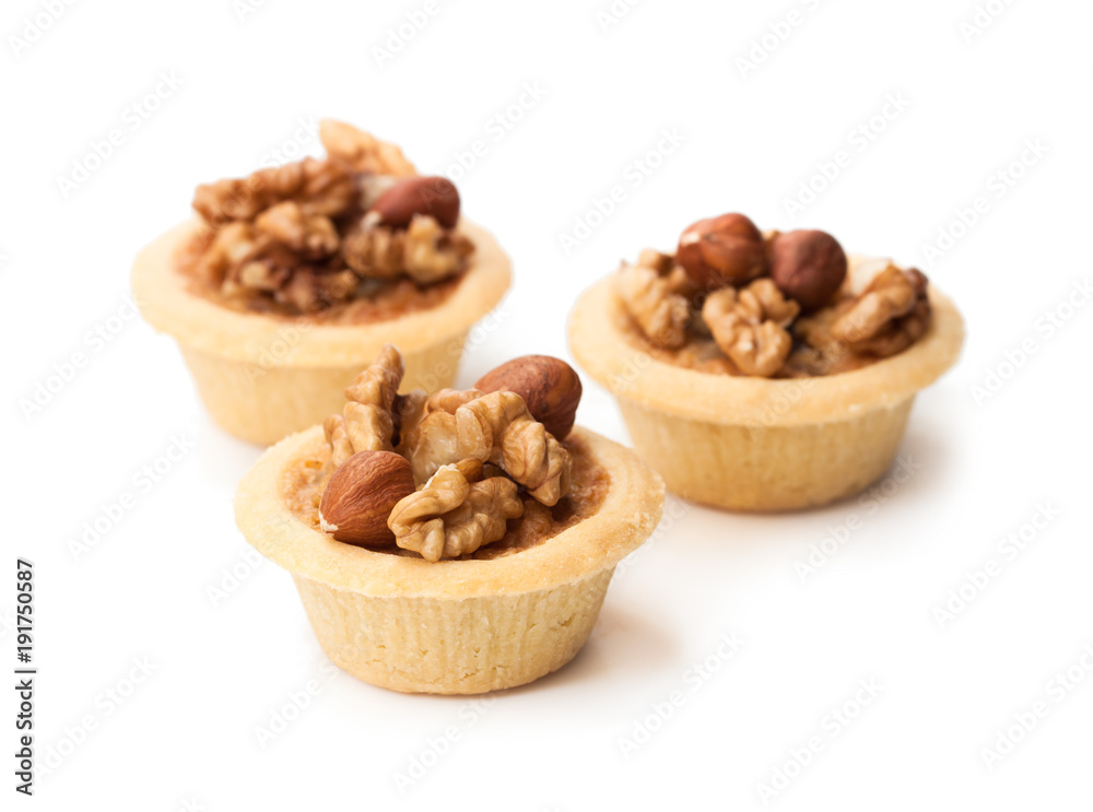 mini ginger and walnut tarts isolated on white mini ginger and walnut tarts isolated on white