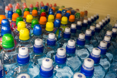 Plastic bottles  colorful caps. Plastic bottles with water  lids.