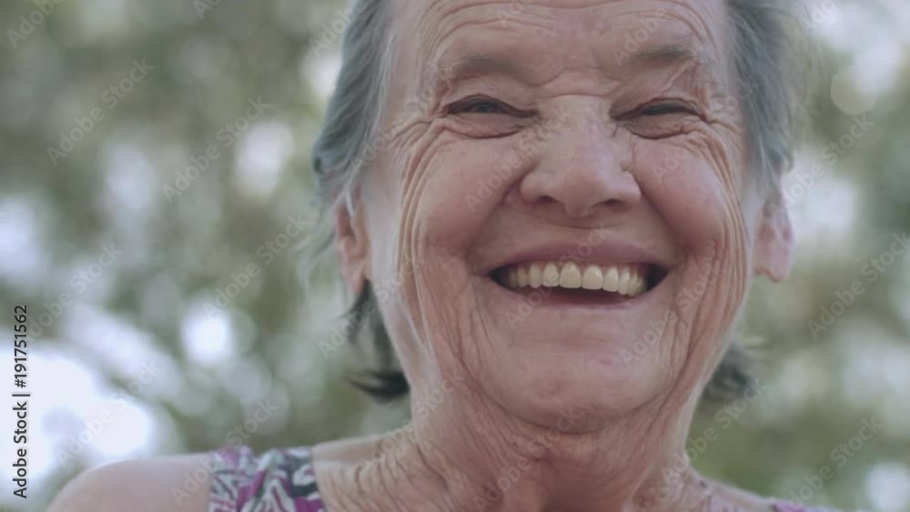 Smiling elderly woman looking at camera
