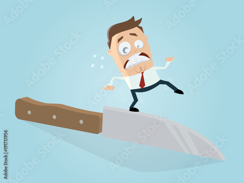 businessman walking on the edge of a knife