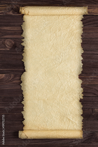 Paper scroll on a wooden ta...
