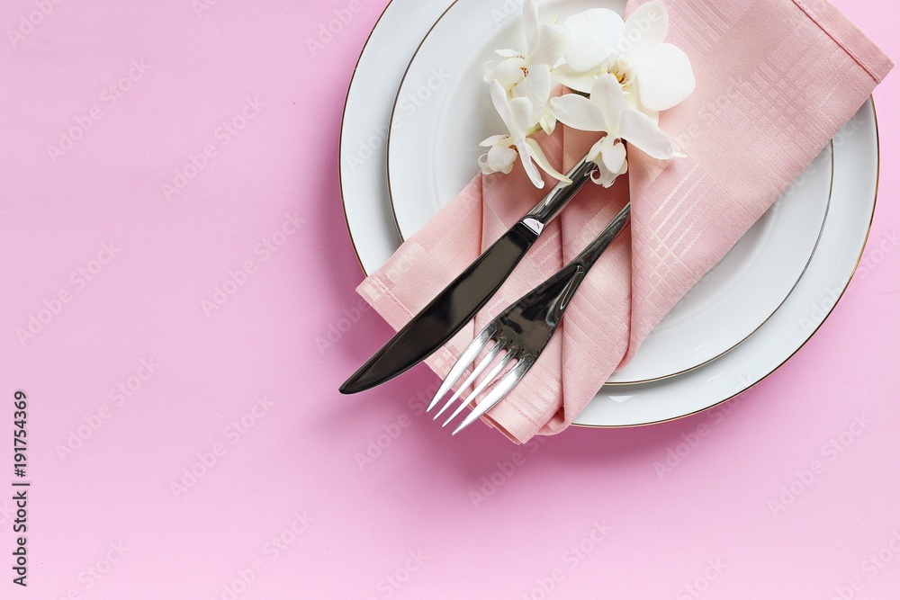 Obraz premium Festive table setting for Valentines Day, Easter, Mother's Day ore wedding. Elegant table decoration with fresh orchid. Overhead view with copy spase