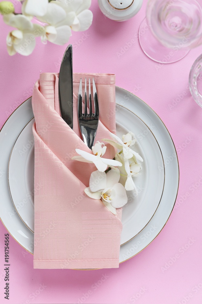 Obraz premium Festive table setting for Valentines Day, Easter, Mother's Day ore wedding. Elegant table decoration with fresh orchid. Overhead view with copy spase