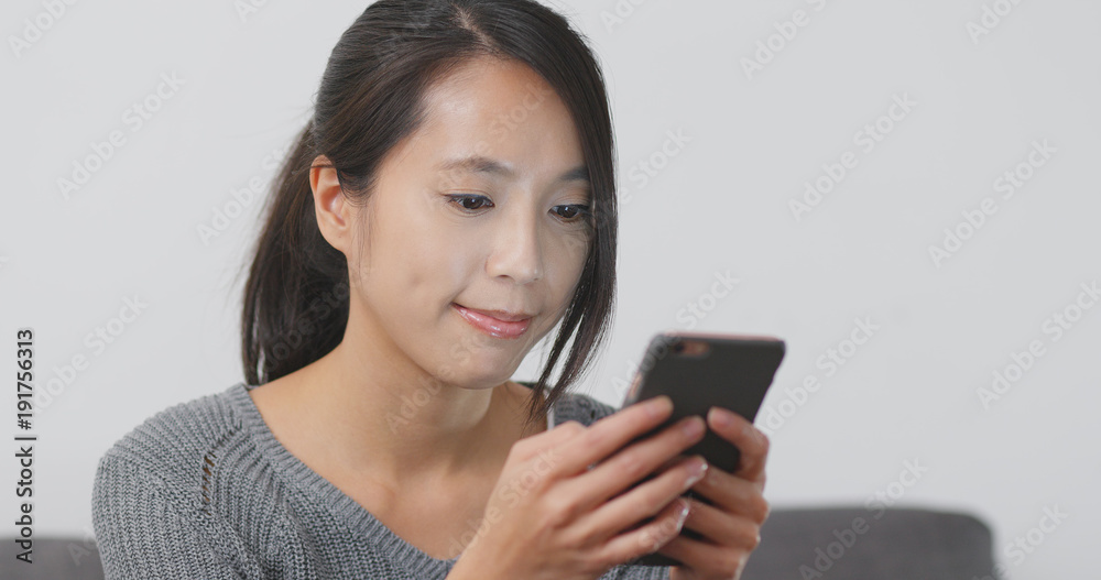 Woman use of mobile phone at home Woman use of mobile phone at home