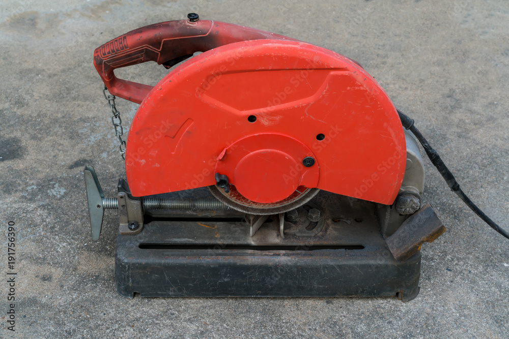 Used Portable Fiber Cut-off Machine in red and black colors on concrete floor