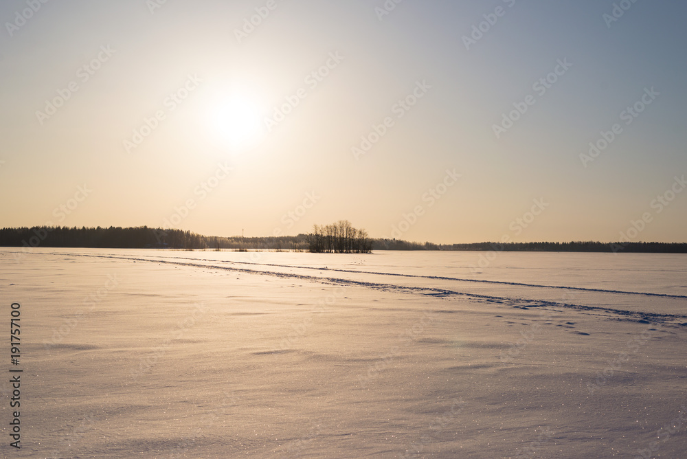 Sunny Day on Snowy Lake Ice