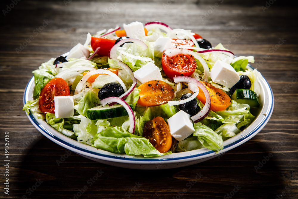 Greek salad on wooden background Greek salad on wooden background
