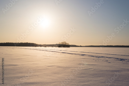 Sunny Day on Snowy Lake Ice