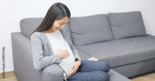 Asian pregnant woman at home
