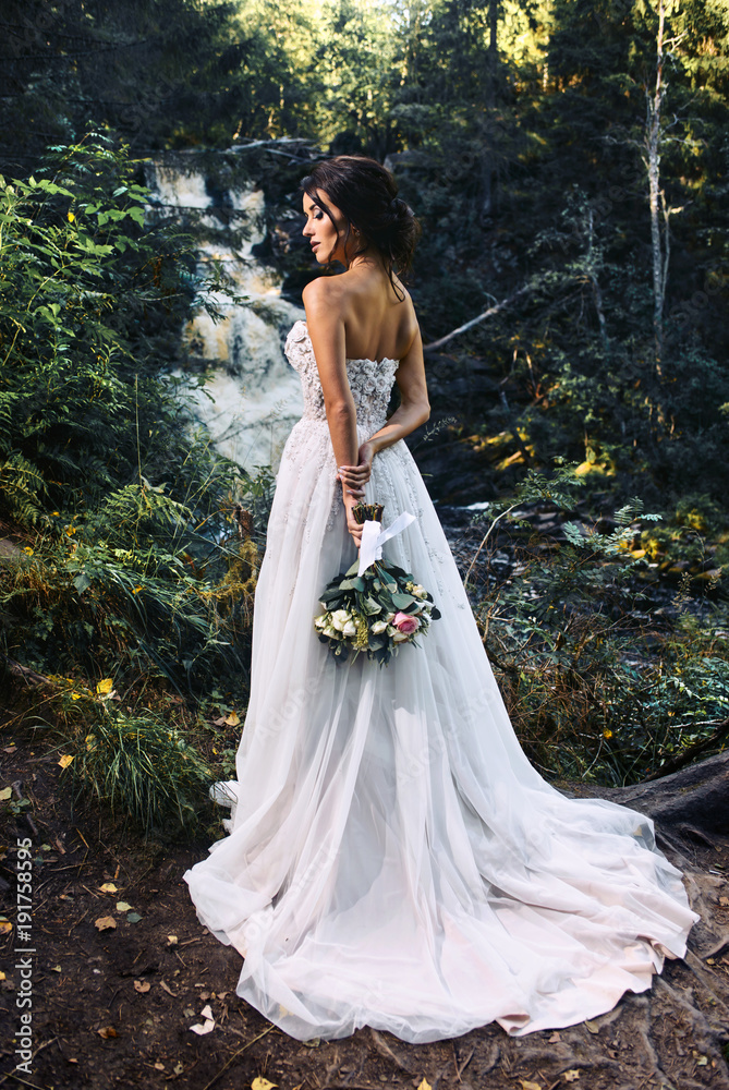 Wedding Beautiful sexy Bride dress young girl fashion Stylish on the nordic Karelian nature landscape background. Marble Canyon Dramatic sky Karelian forest Waterfall river in   mountains