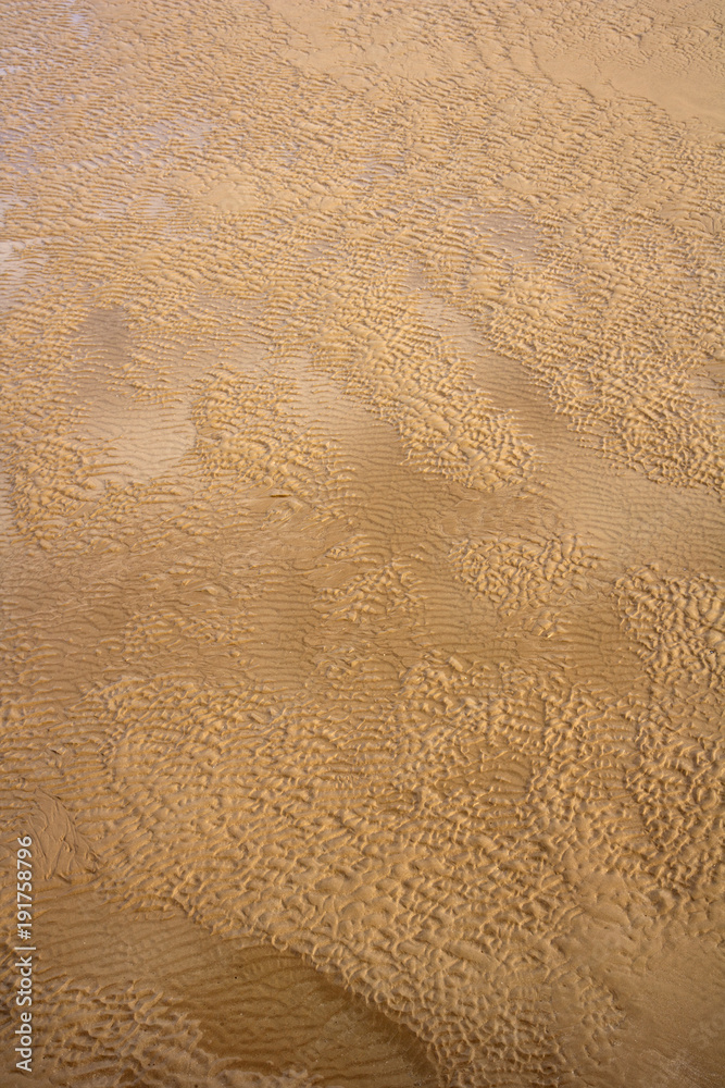 Ripples in the sand and seawater texture Ripples in the sand and seawater texture