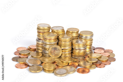 A pile of euro coins stacked in columns and isolated on white