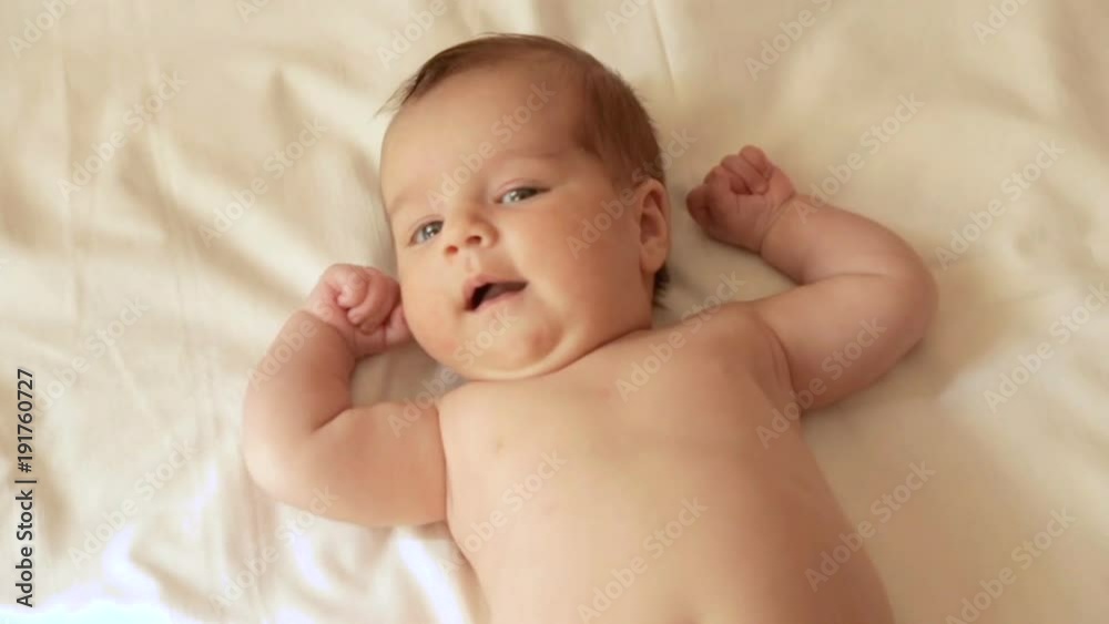 Mom tenderly embraced the baby's small hands Mom tenderly embraced the baby's small hands