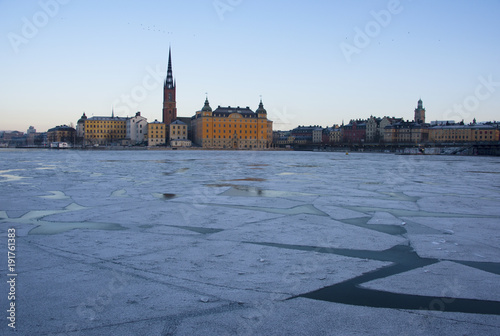 Landmarks an houses at the island Riddarholmen at the lake Malaren in Stockhlom a cold winter day photo