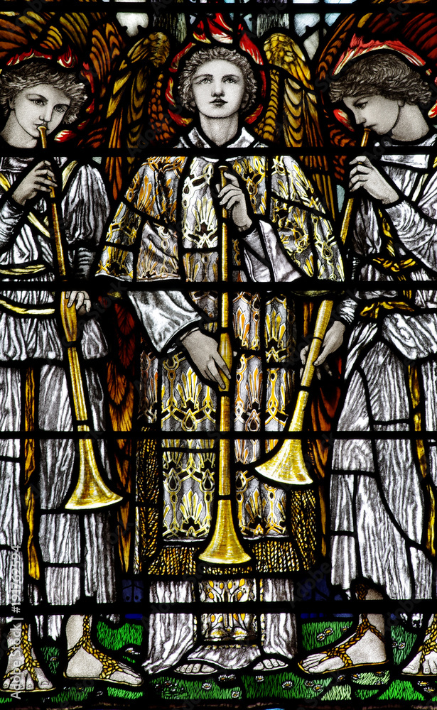 Three Angels making music; blowing on a trumpet (stained glass)