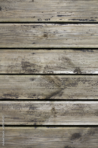 Distressed old decking boards in need of treatment