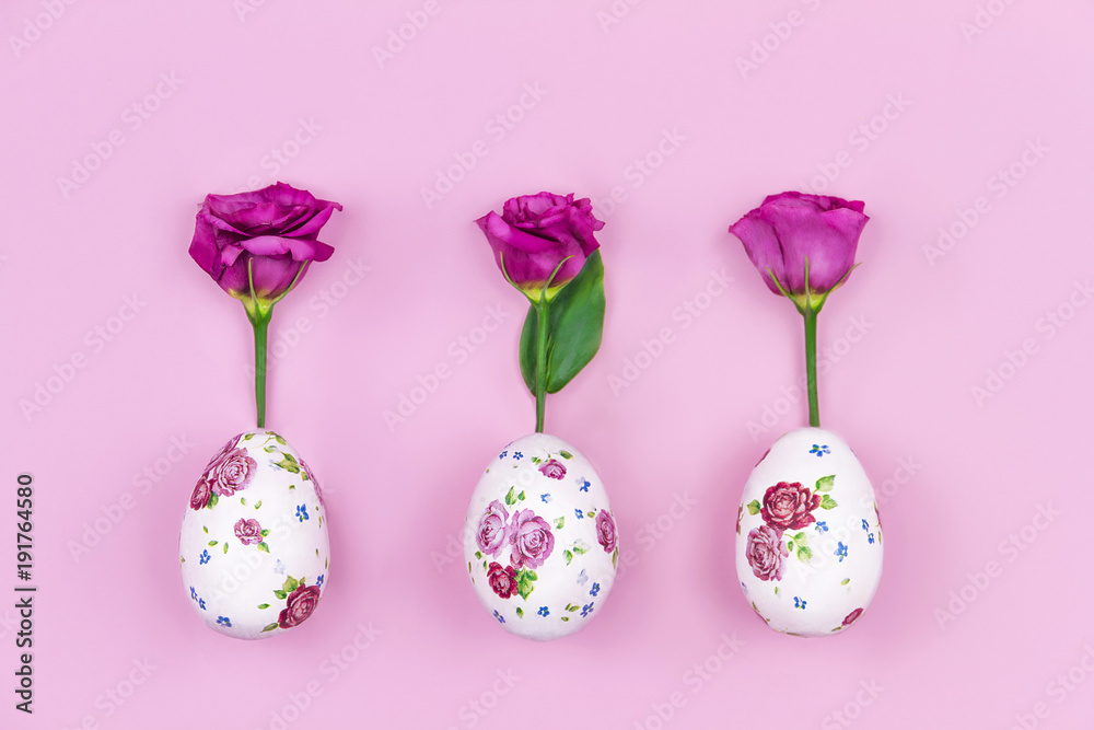 Happy Easter and Spring is coming concept. Fresh spring's red flowers roses grow from easter eggs with flower pattern on pink background. Happy Easter and Spring is coming concept. Fresh spring's red flowers roses grow from easter eggs with flower pattern on pink background.