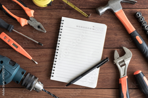 Set of work tools on wooden background photo