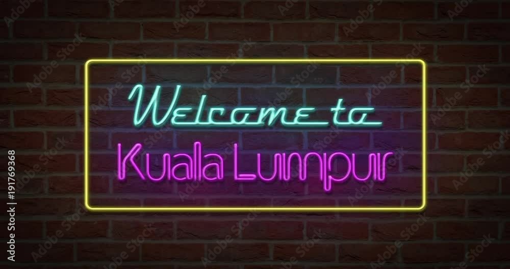 Neon text sign of Welcome to Kuala Lumpur in brick background Neon text sign of Welcome to Kuala Lumpur in brick background