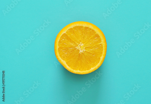 Fresh orange on blue background