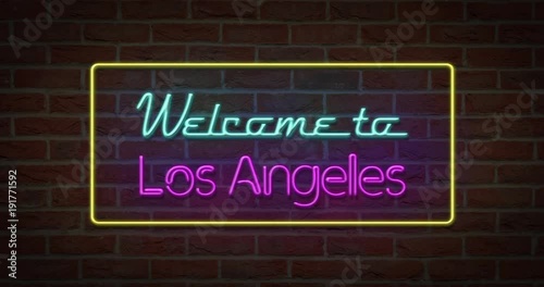 Neon text sign of Welcome to Los Angeles in brick background