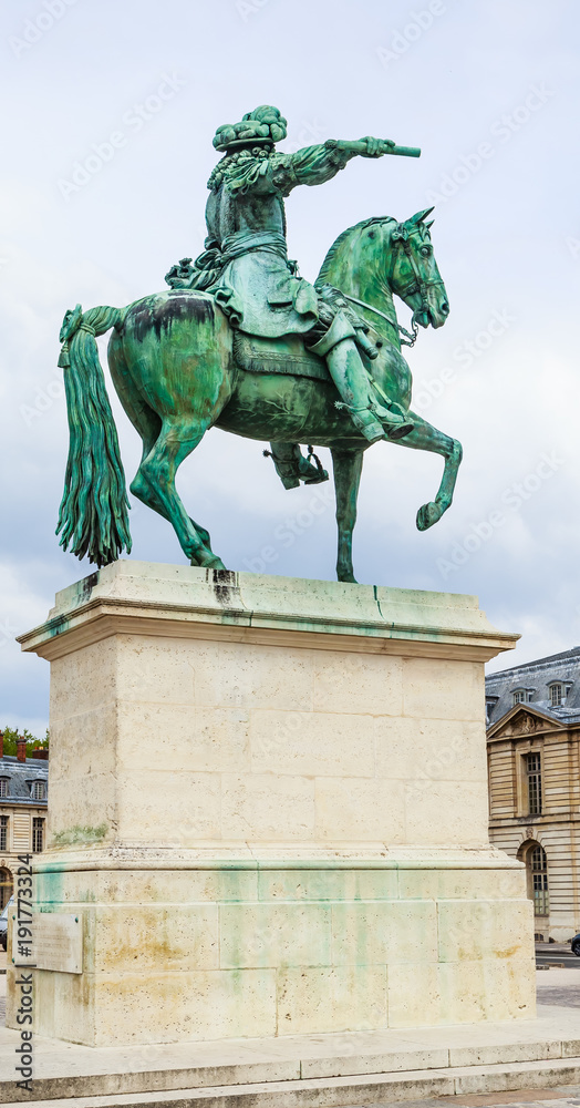 King Louis XIV statue in front of Palace of Versailles, France, Stock