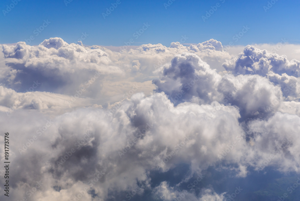 Cumulus cloudscape seen from a window plane