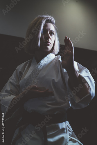 Woman who is exercised practicing karate