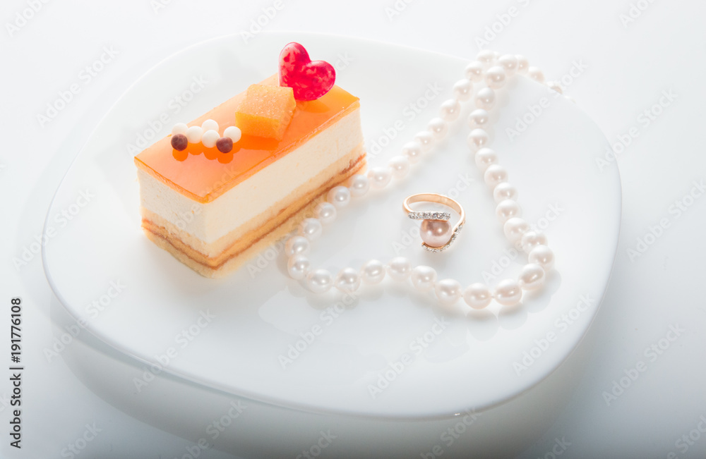 Valentine's day background, Love concept, two heart in pearl necklace on saucer Valentine's day background, Love concept, two heart in pearl necklace on saucer