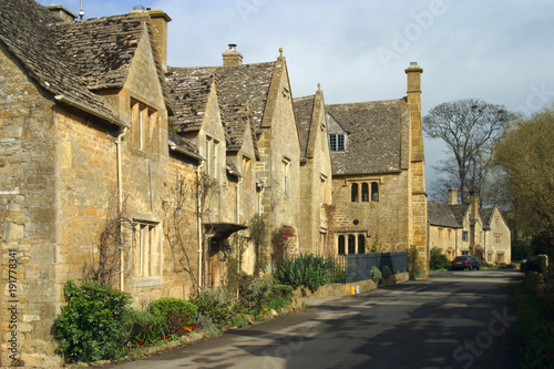 England, Cotswolds, Gloucestershire, a picturesque street scene in the village of Stanton photo
