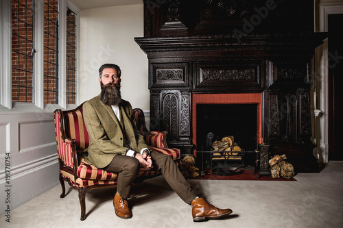 Smart man with a beard and moustache wearing a suit