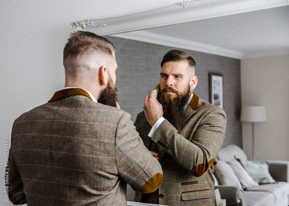 Fotografie Smart man with a beard and moustache in a suit