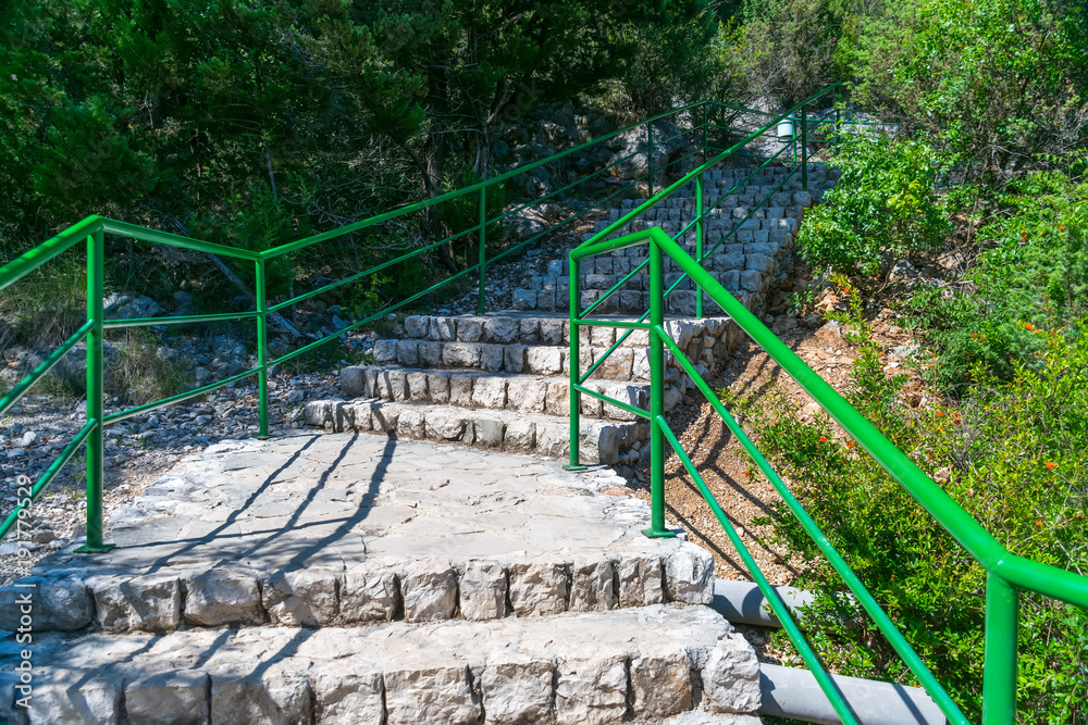 A romantic alley leads to the foot of the Kravice waterfall. A romantic alley leads to the foot of the Kravice waterfall.