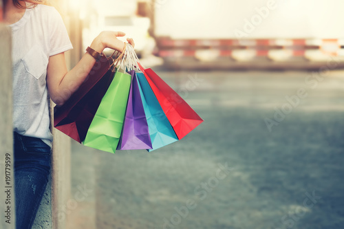 shopping mall. Happy woman holding shopping many color bag enjoying in shopping. Consumerism, shopping, lifestyle concept