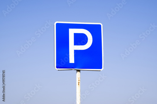 Road sign parking. Sign on a blue sky background.