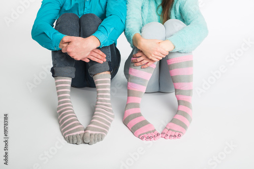 Valentine's day concept - Male and female legs in socks. photo