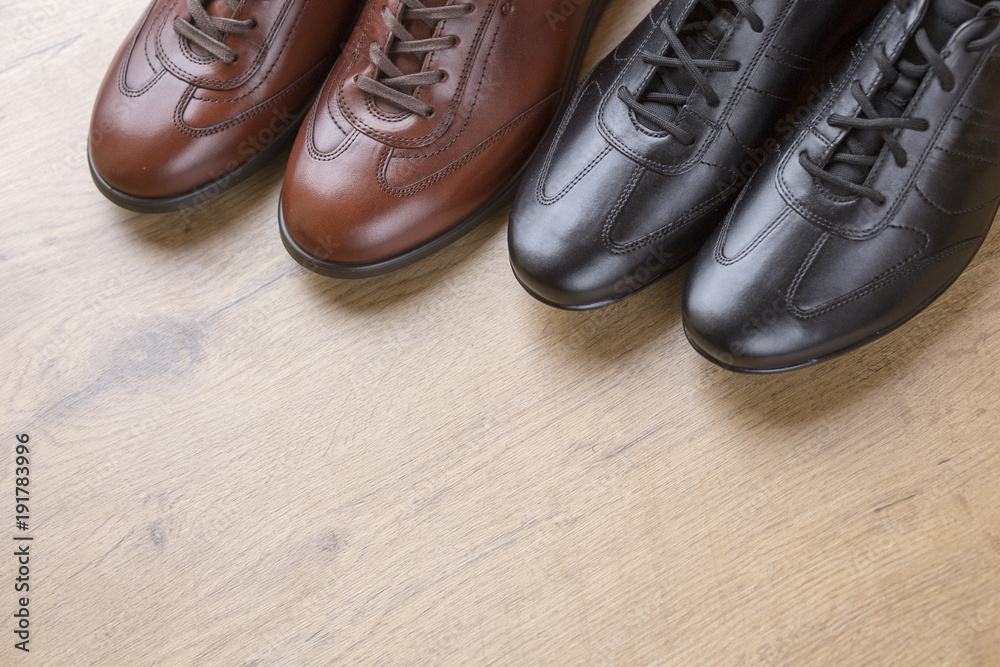 Stylish men leather shoes on wooden background