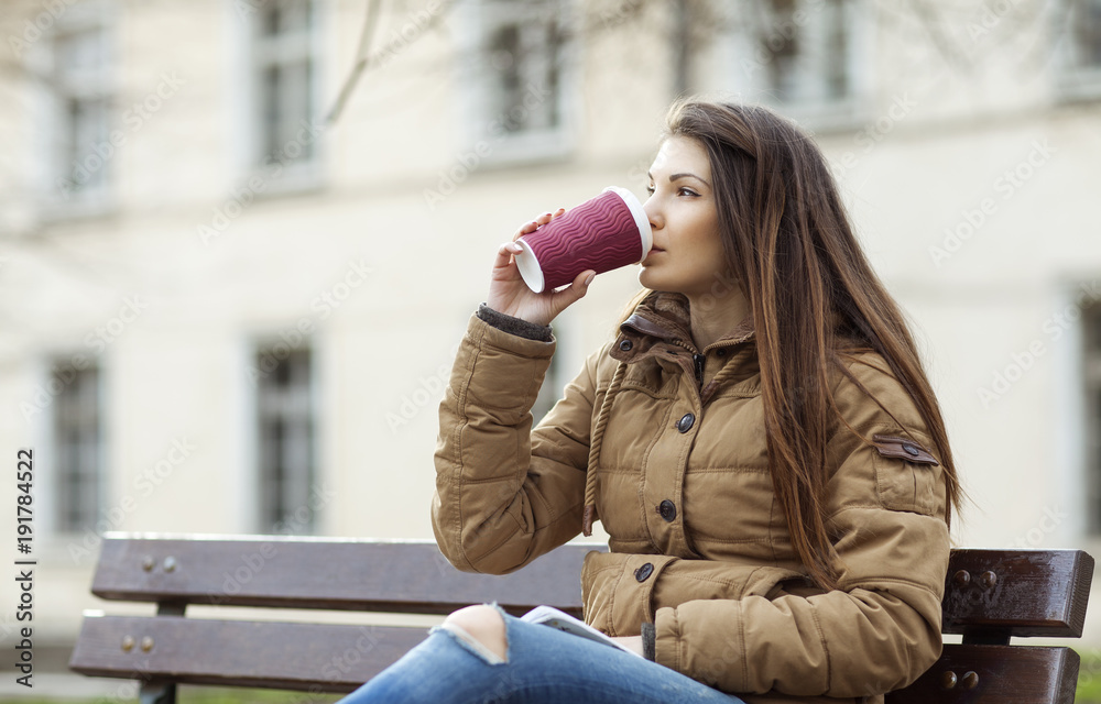 Beautiful woman drinking coffee from a mug. Beautiful woman drinking coffee from a mug.