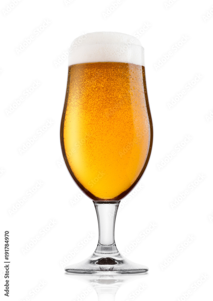 Cold glass of lager ale beer with foam and dew Cold glass of lager ale beer with foam and dew