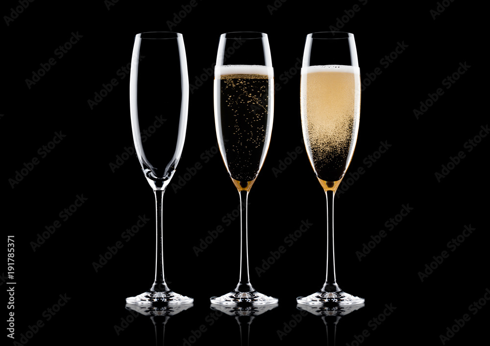 Elegant glasses of yellow champagne with bubbles Elegant glasses of yellow champagne with bubbles
