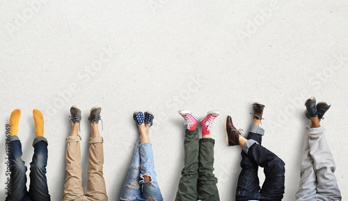 People's legs at the wall during a break in work photo