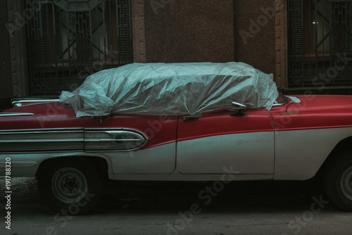destroyed car on the streets of Havana, Cuba photo