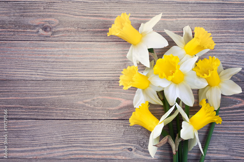 Fototapeta Naklejka Na Ścianę i Meble -  Daffodils flowers on wooden background 